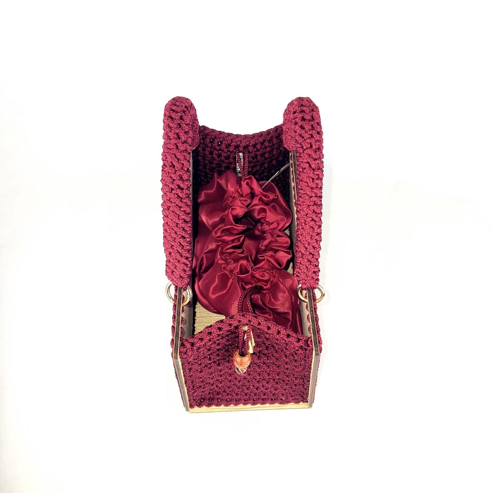 Daafua large-wood carved plate crochet handbag