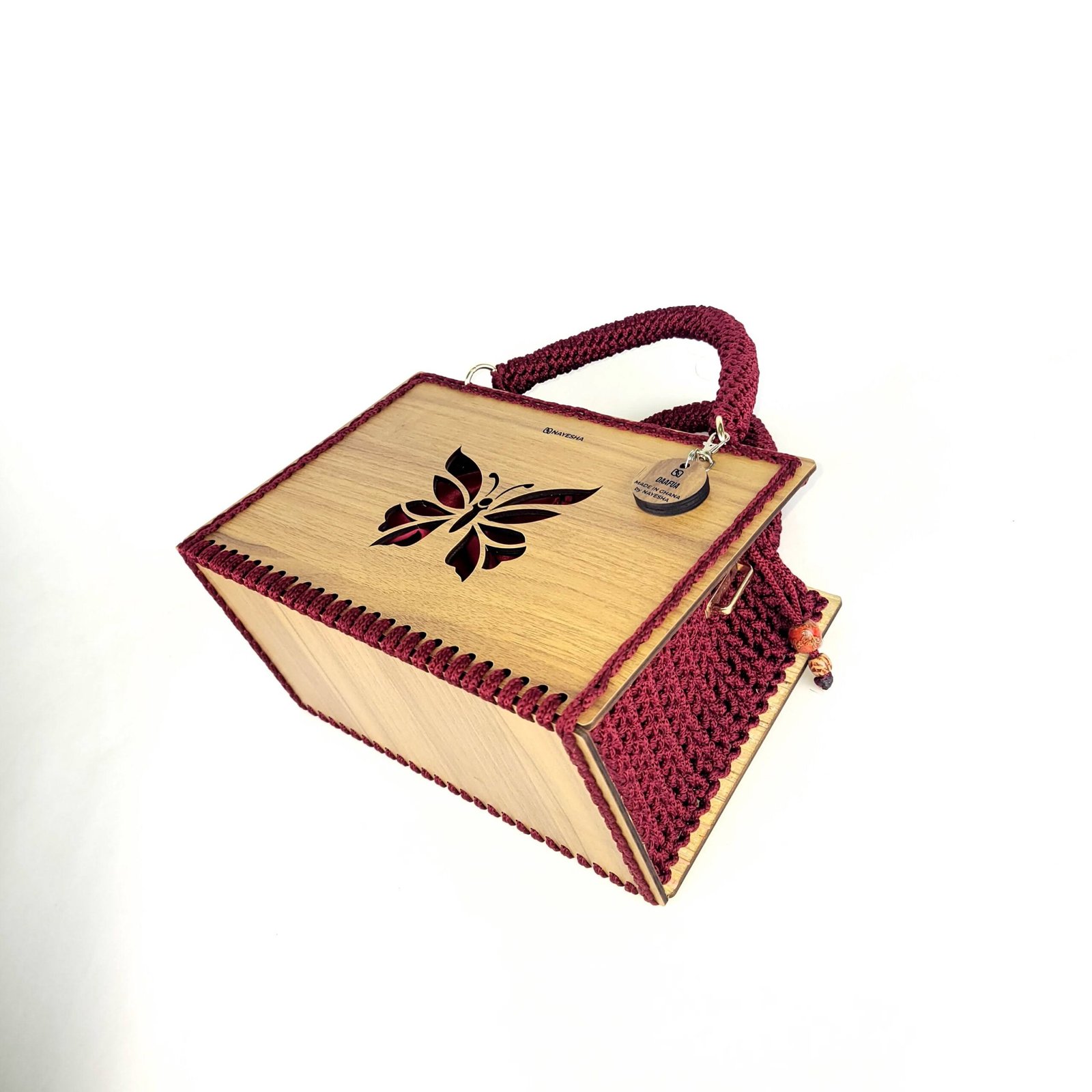 Daafua large-wood carved plate crochet handbag