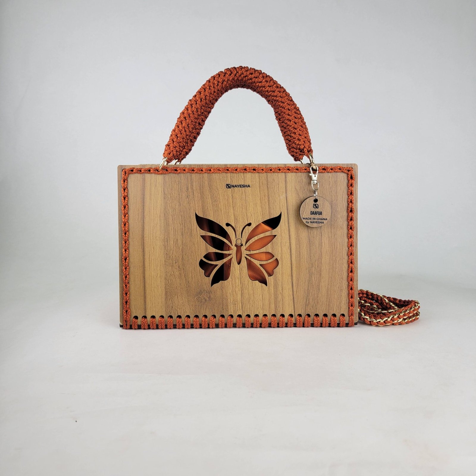 Daafua large-wood carved plate crochet handbag