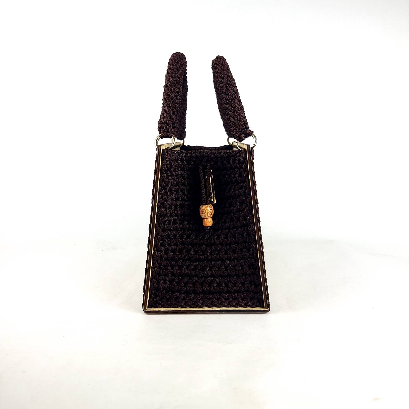 Daafua large-wood carved plate crochet handbag