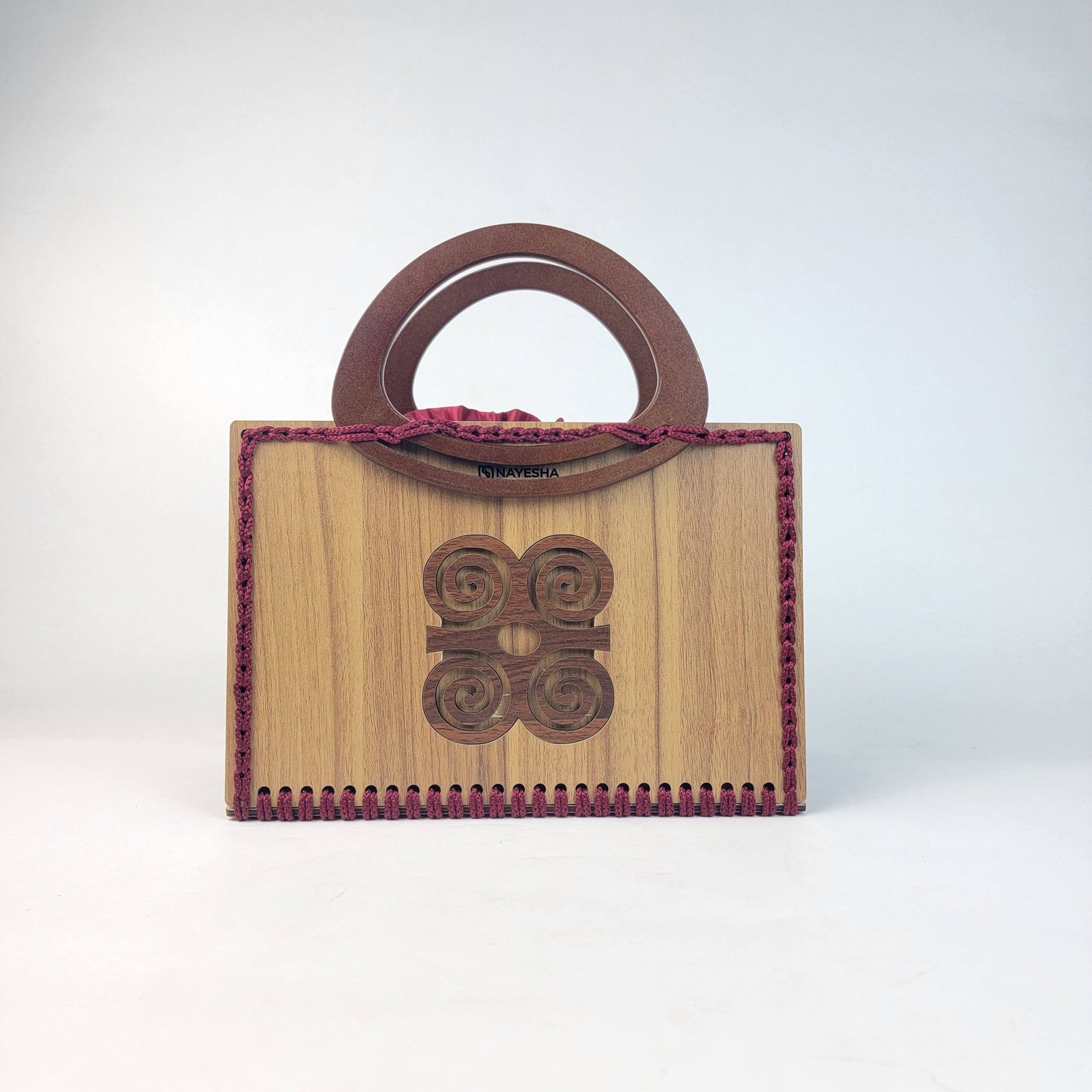 Daafua large-wood carved plate crochet handbag