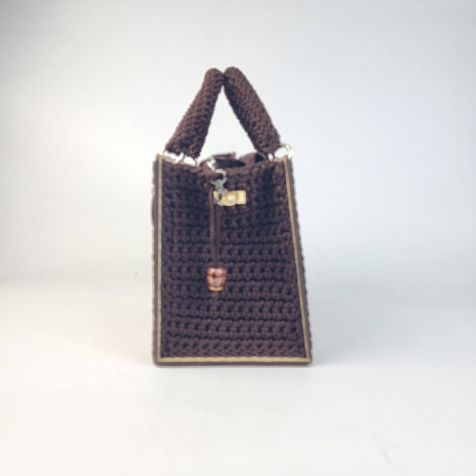 Daafua large-wood carved plate crochet handbag