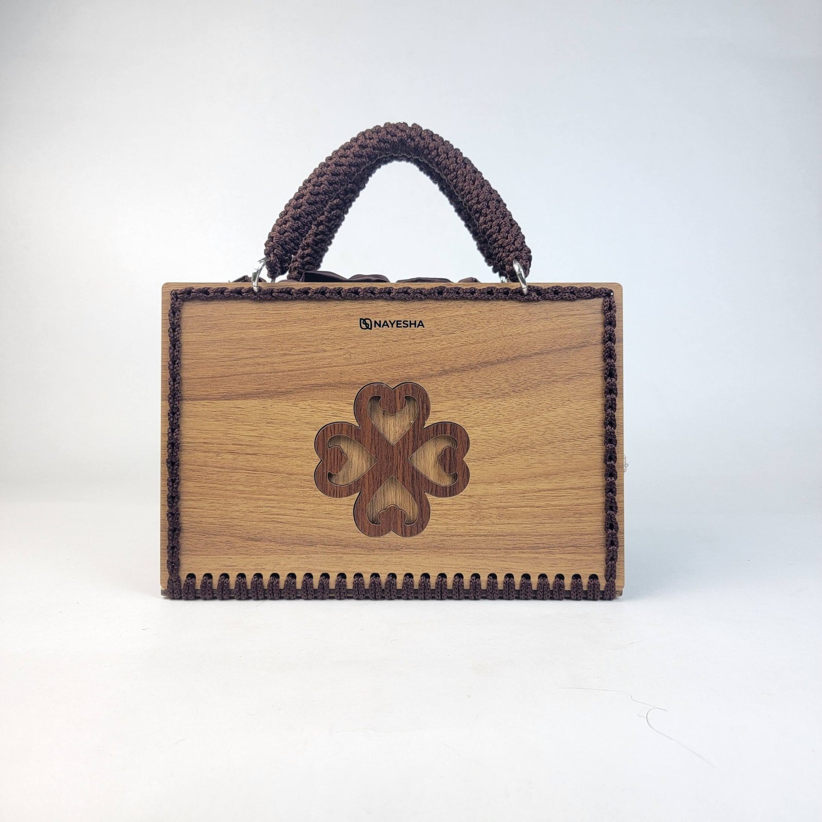 Daafua large-wood carved plate crochet handbag