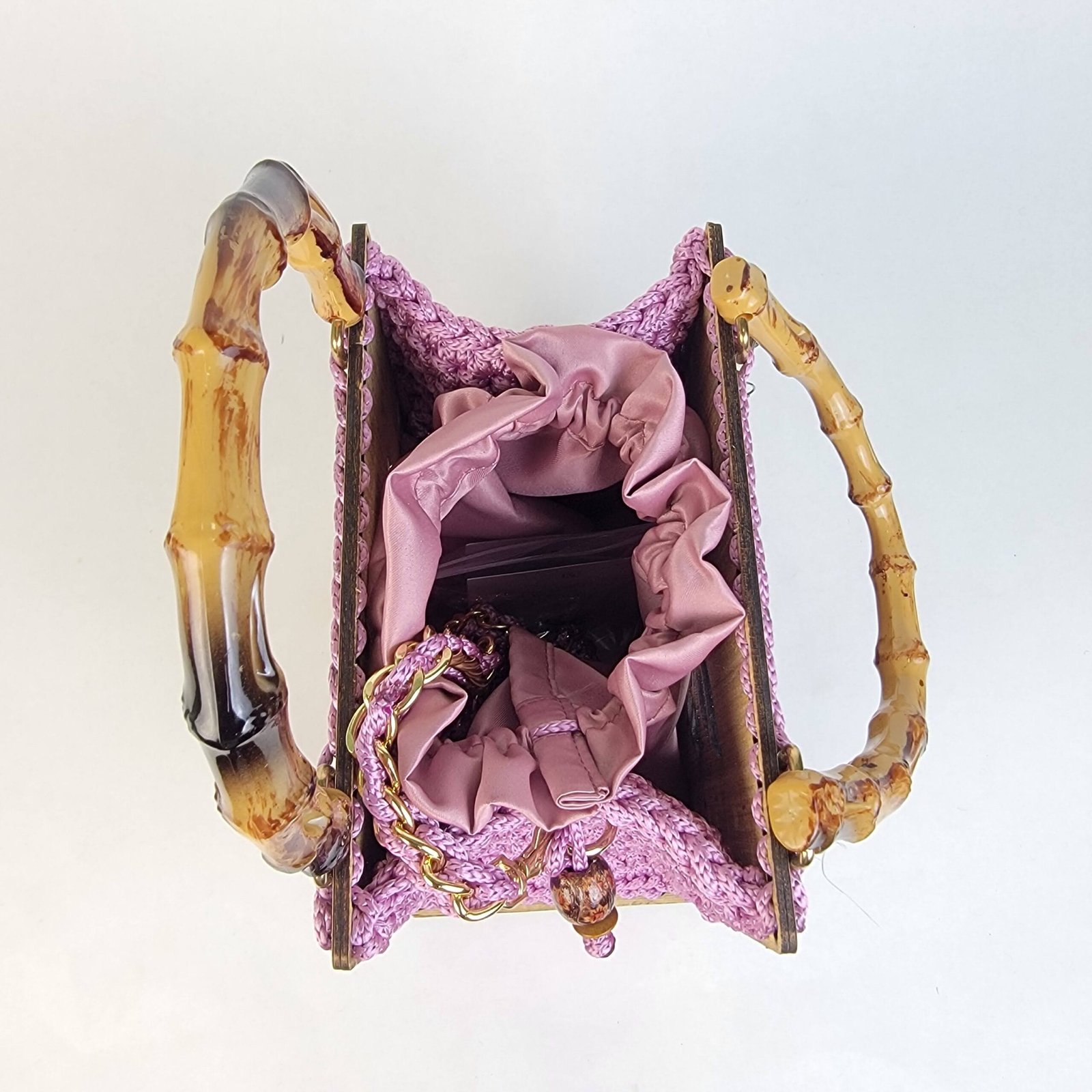 Daafua medium-wood carved plate crochet handbag