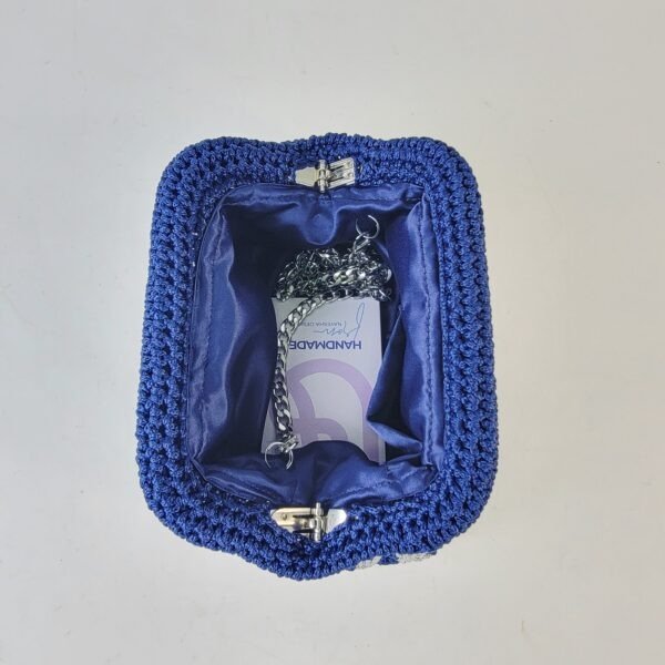 20260303_085813 Naki Clutch (medium)
